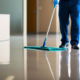 Janitorial worker mopping floor inside a commercial facility