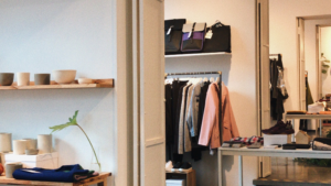 Clean and organized boutique with clothing and product displays