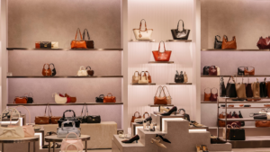 Clean luxury retail store with organized handbag displays