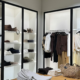 Modern clothing store with clean displays and organized merchandise