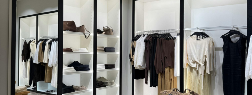 Modern clothing store with clean displays and organized merchandise