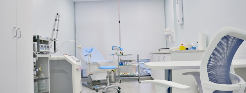 Clean medical treatment room prepared for patient care