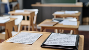 School desks and learning materials in an empty classroom