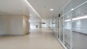 Finished commercial hallway with glass walls and clean floors