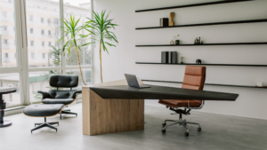 Modern private office with desk, seating, and large windows